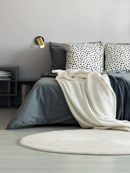 modrian-Vase,On,Metal,Table,And,Grey,Lamp,In,Spacious,Bedroom