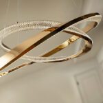 ORBITAS - Lámpara LED 2 aros oro brillo con difusor transparente.